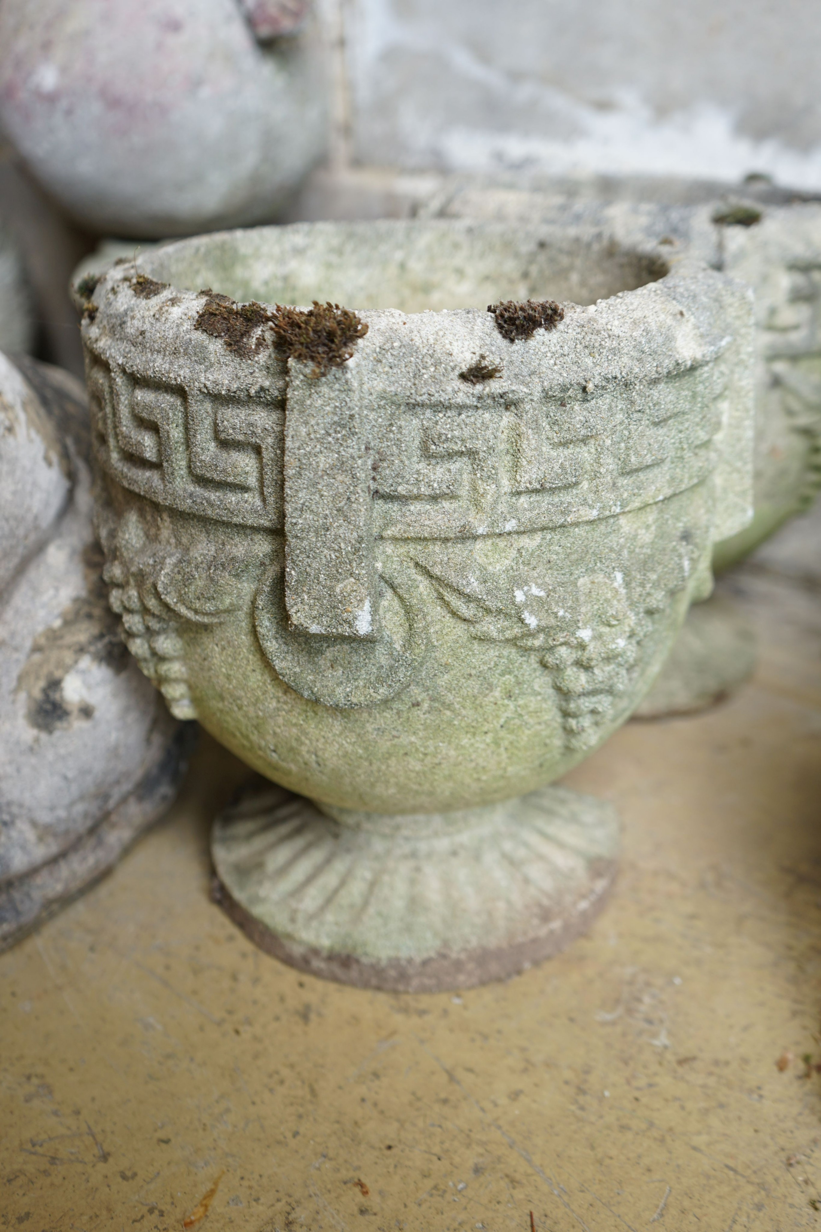 A pair of circular reconstituted garden planters, diameter 22cm